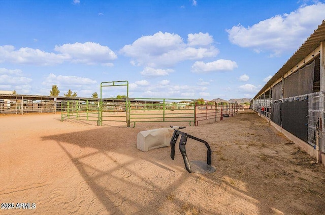 view of stable featuring a rural view