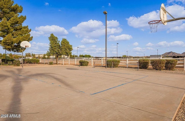 view of basketball court featuring community basketball court and fence