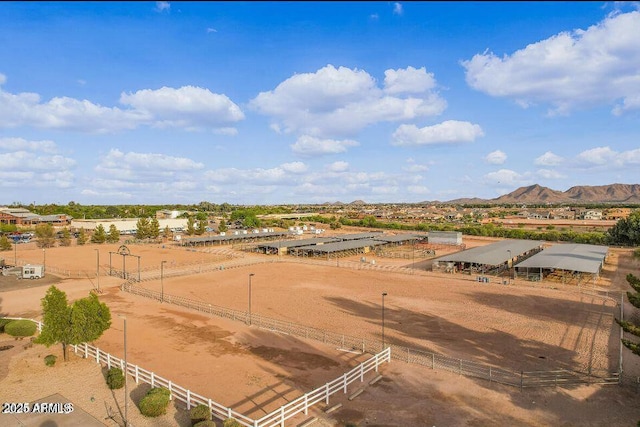 birds eye view of property with a mountain view