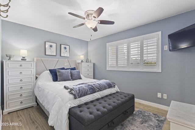 bedroom with wood-type flooring and ceiling fan