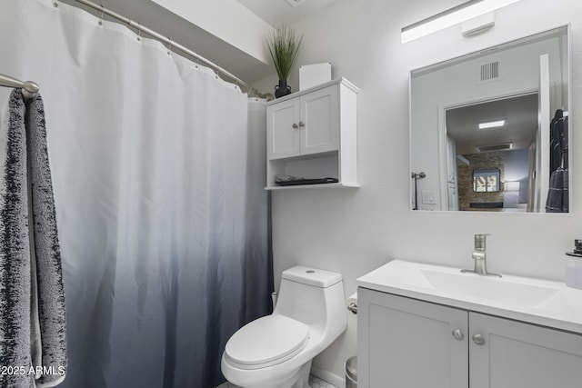 bathroom featuring toilet and vanity