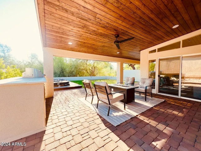 view of patio featuring an outdoor living space and ceiling fan