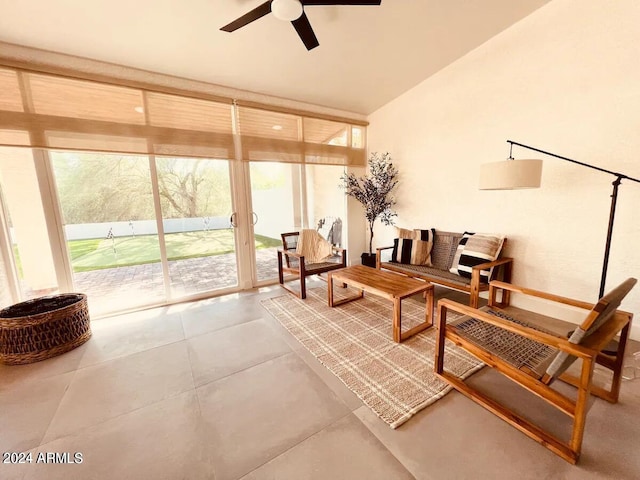 interior space featuring ceiling fan and lofted ceiling