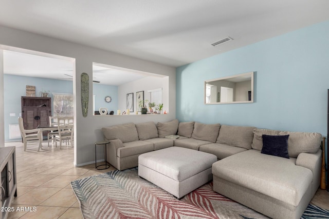 living area with light tile patterned floors and visible vents