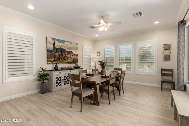 dining area with crown molding, ceiling fan, visible vents, and baseboards