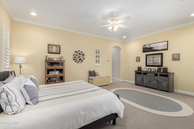 bedroom with arched walkways, crown molding, light carpet, and baseboards