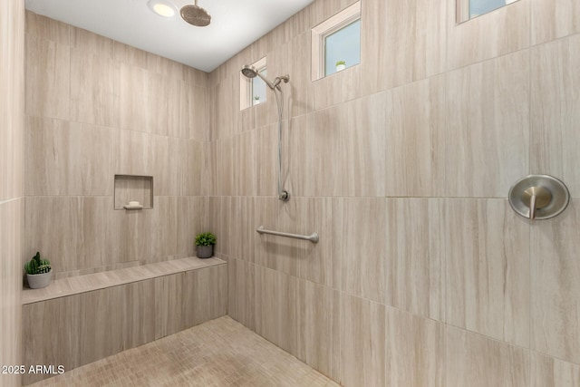 full bath featuring tiled shower