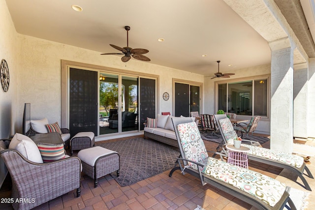 view of patio / terrace with a ceiling fan and an outdoor living space