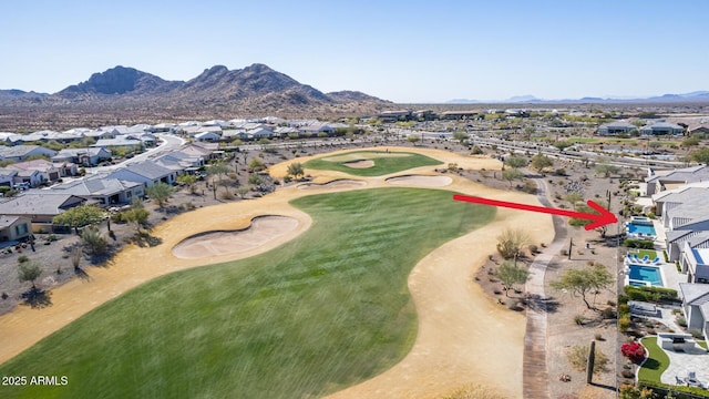 aerial view with a residential view, view of golf course, and a mountain view