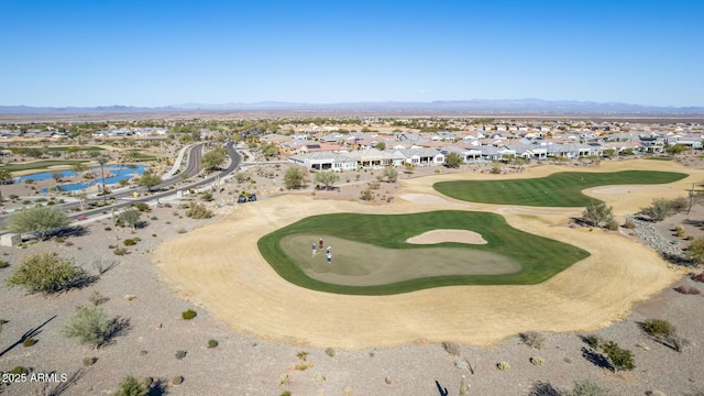 bird's eye view with a mountain view, view of golf course, and a residential view