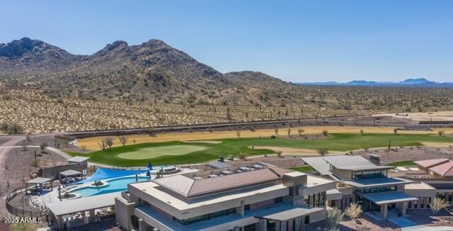 bird's eye view with a mountain view and golf course view