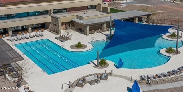 community pool featuring a patio area