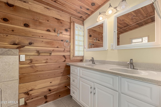 full bath with wooden ceiling, double vanity, tile patterned floors, and a sink