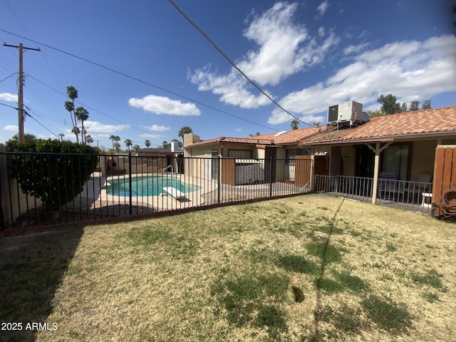 view of yard featuring cooling unit, a patio, a fenced in pool, and fence