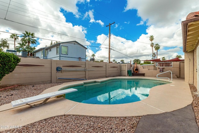 view of swimming pool with a fenced in pool, a patio, and a fenced backyard