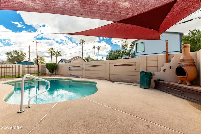 view of pool featuring a fenced in pool, a patio, and a fenced backyard