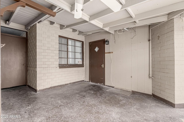 property entrance featuring brick siding