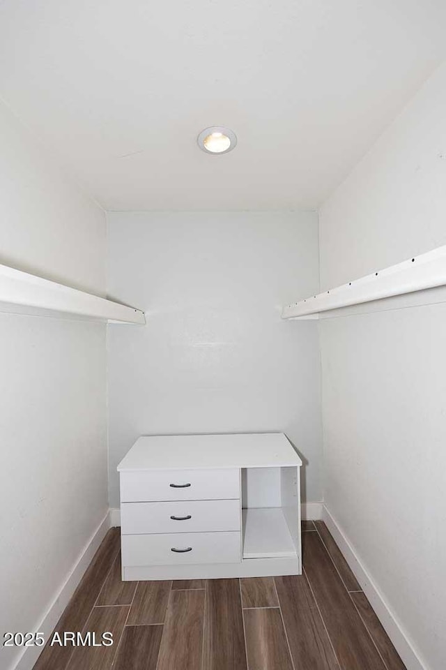9355 N 91st St Unit 112, Scottsdale, AZ 85258 - walk in closet featuring dark wood-style flooring
