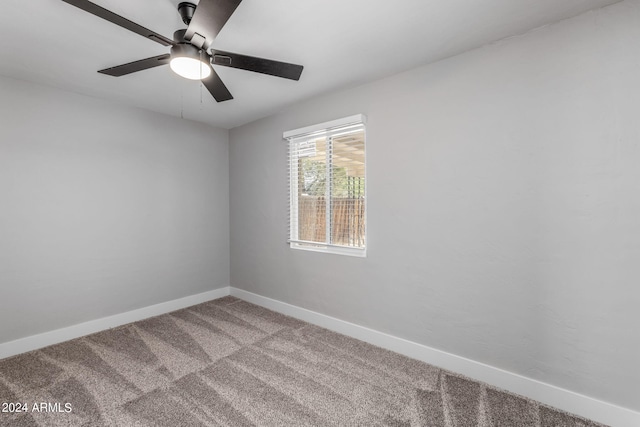 empty room featuring carpet floors and ceiling fan