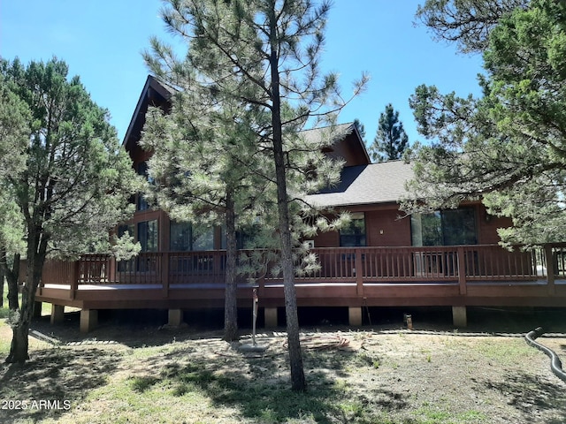 rear view of house with a wooden deck