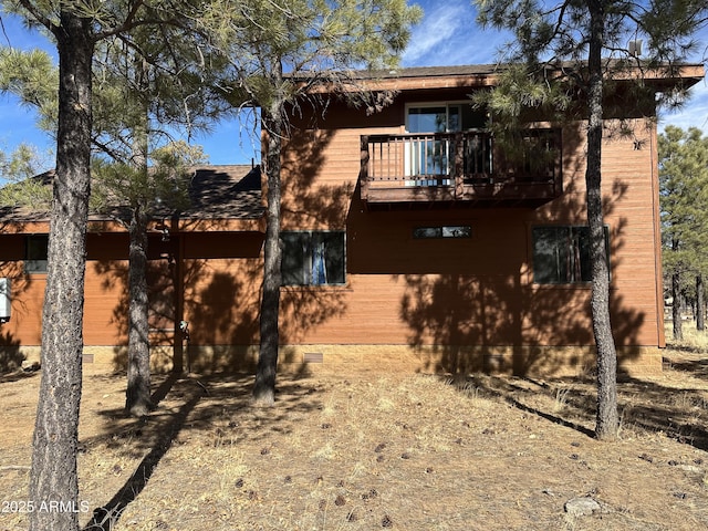 rear view of house with a balcony