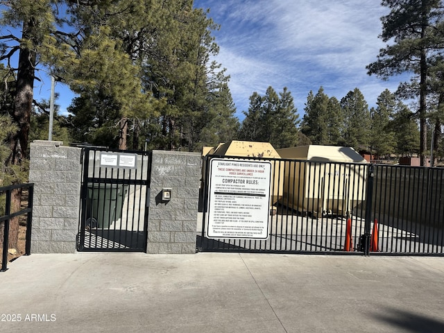 view of gate with fence