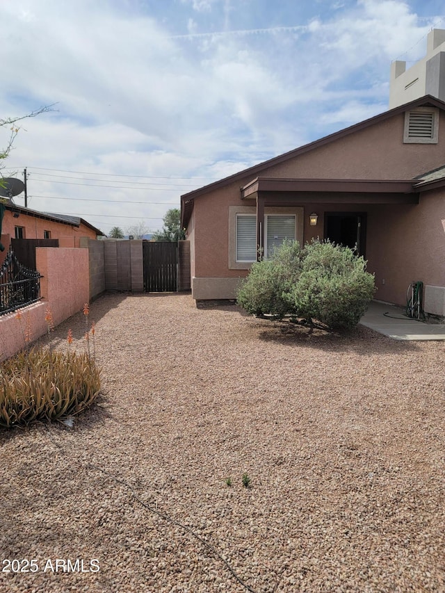 1829 E Adams St, Phoenix, AZ 85034 - view of yard featuring a gate and fence
