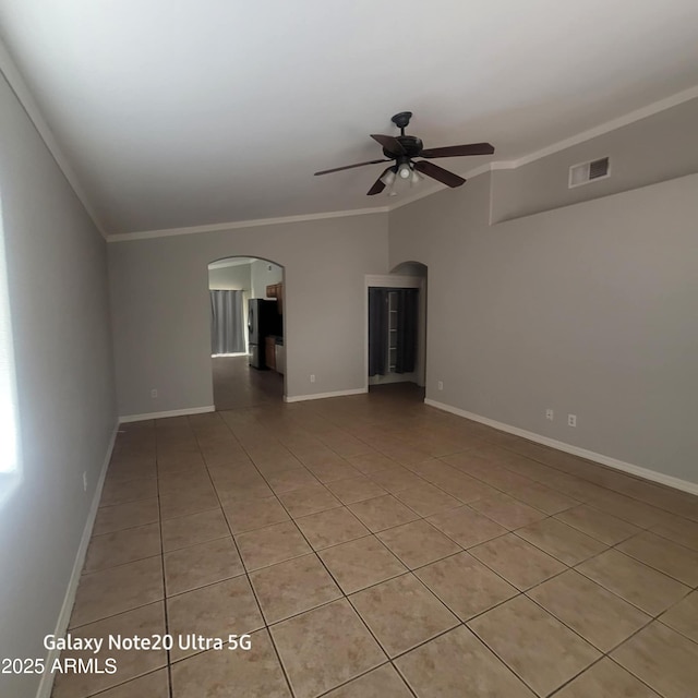 1829 E Adams St, Phoenix, AZ 85034 - unfurnished room featuring a ceiling fan, baseboards, visible vents, arched walkways, and ornamental molding