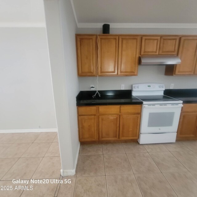 1829 E Adams St, Phoenix, AZ 85034 - kitchen with light tile patterned flooring, brown cabinetry, under cabinet range hood, electric stove, and dark countertops