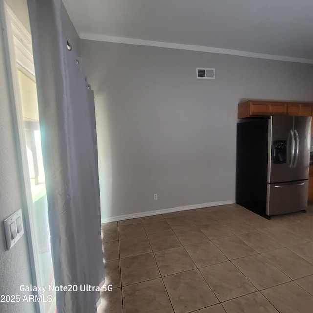 1829 E Adams St, Phoenix, AZ 85034 - kitchen featuring light tile patterned floors, visible vents, stainless steel fridge, and crown molding