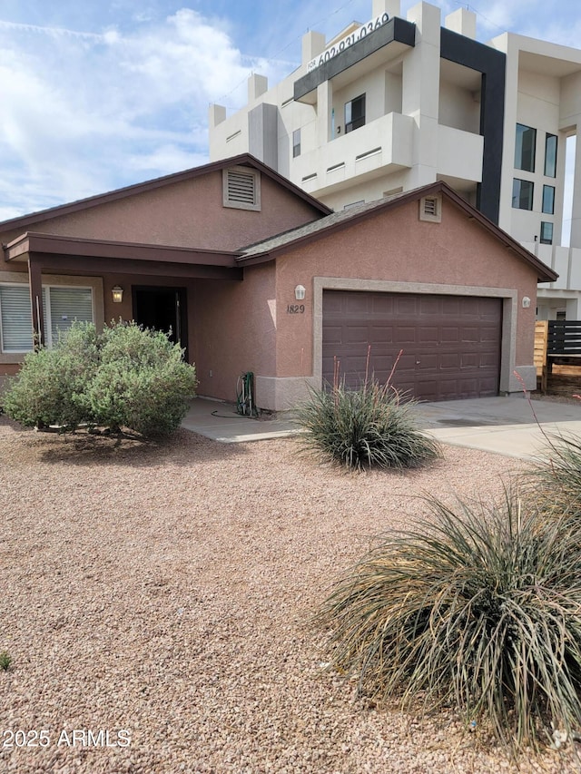 1829 E Adams St, Phoenix, AZ 85034 - view of front of property with driveway and stucco siding