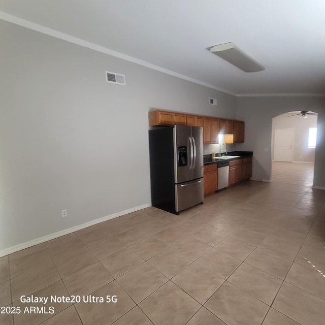 1829 E Adams St, Phoenix, AZ 85034 - kitchen featuring visible vents, ornamental molding, stainless steel appliances, dark countertops, and a sink