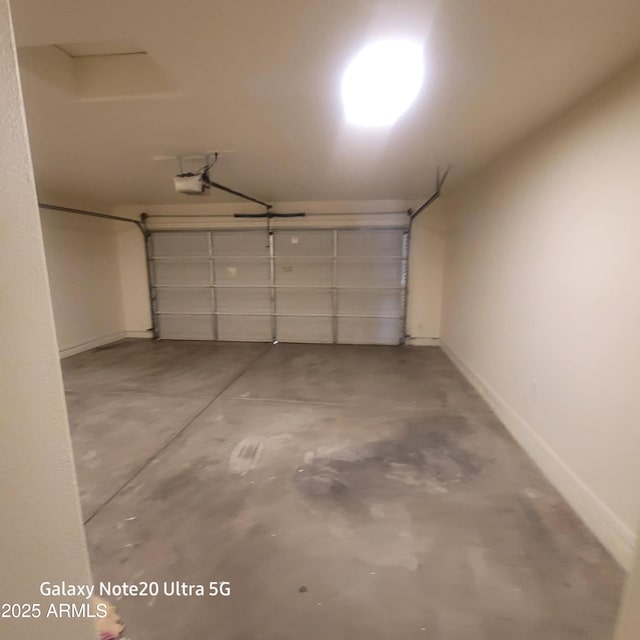 1829 E Adams St, Phoenix, AZ 85034 - garage featuring a garage door opener and baseboards