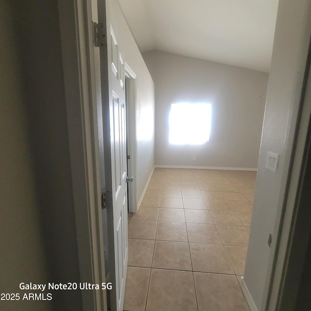 1829 E Adams St, Phoenix, AZ 85034 - tiled spare room featuring baseboards and lofted ceiling