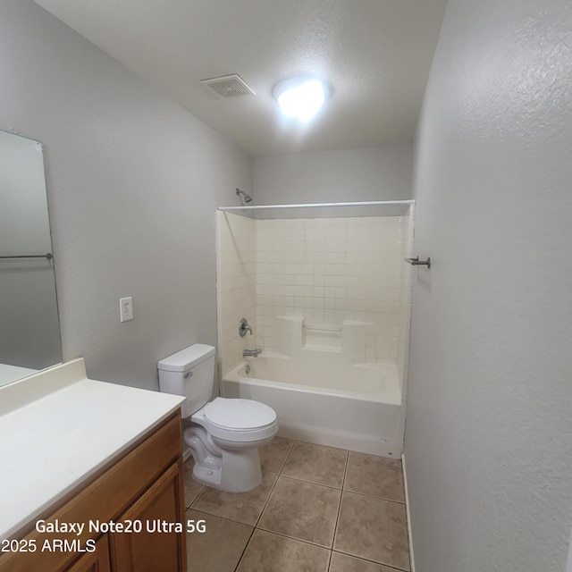 1829 E Adams St, Phoenix, AZ 85034 - bathroom featuring tile patterned floors, toilet, vanity,  shower combination, and visible vents