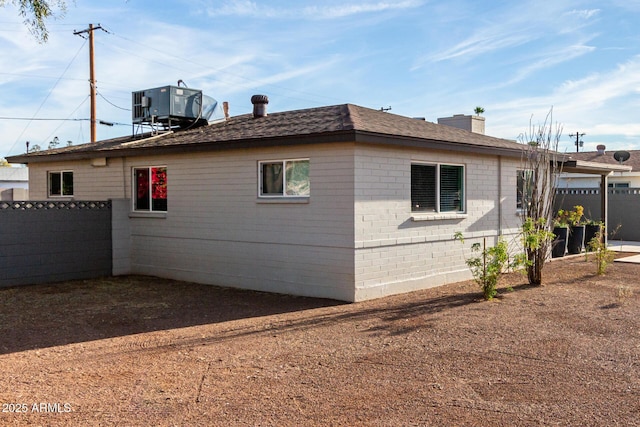 view of side of home featuring cooling unit