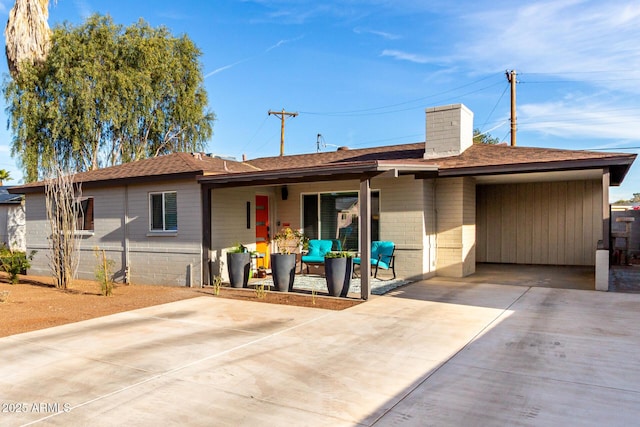 back of property with a patio