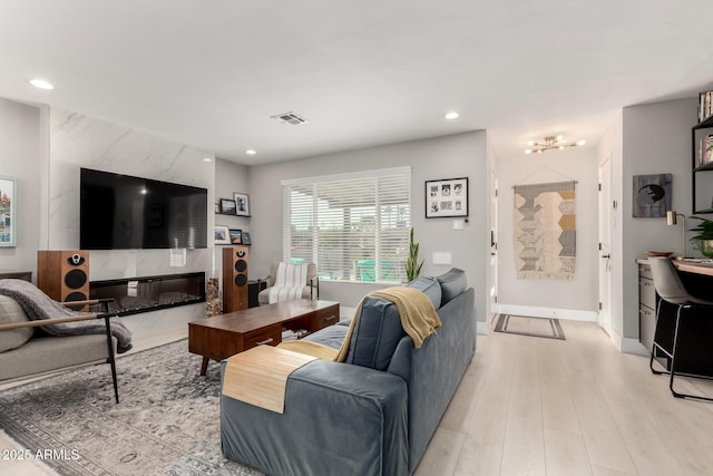 living room with light hardwood / wood-style flooring