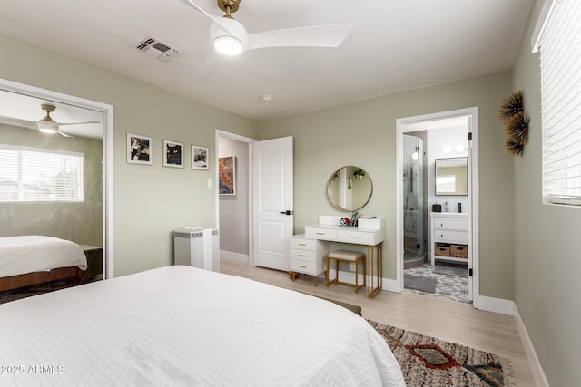 bedroom featuring radiator, light hardwood / wood-style flooring, and ceiling fan