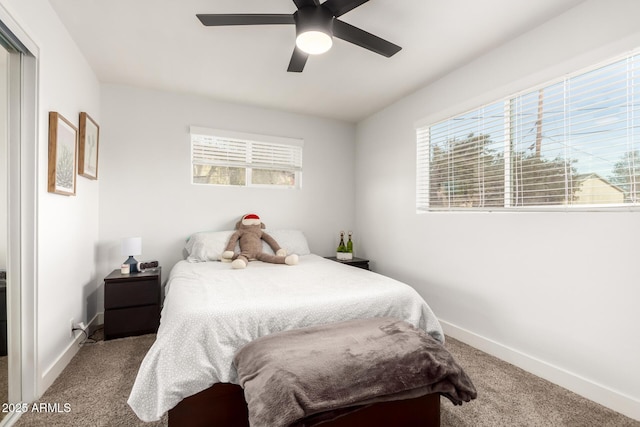 bedroom featuring multiple windows, carpet floors, and ceiling fan