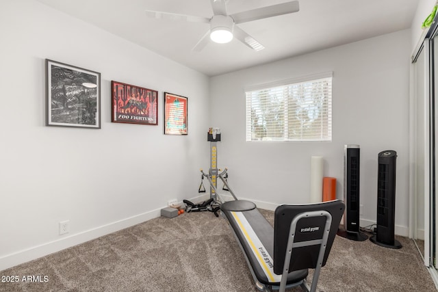 workout room with ceiling fan and carpet floors