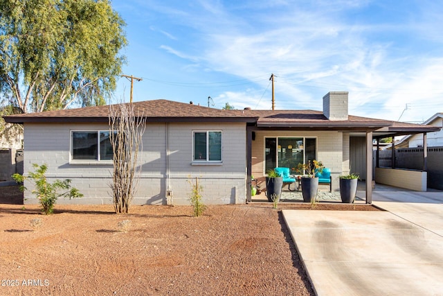 rear view of property featuring a patio