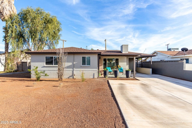 view of front of home with a carport