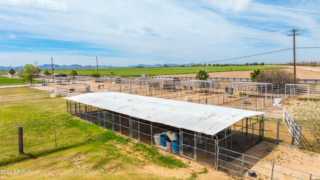 birds eye view of property with a rural view and a mountain view