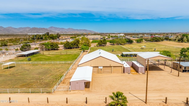 birds eye view of property with a mountain view