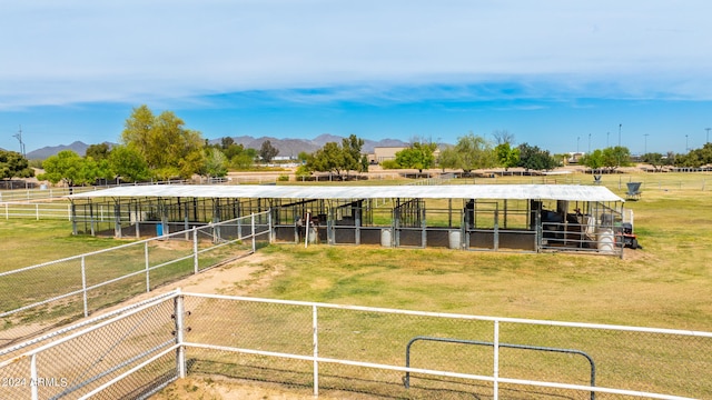 view of stable with a mountain view