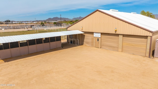 garage featuring a carport and a mountain view