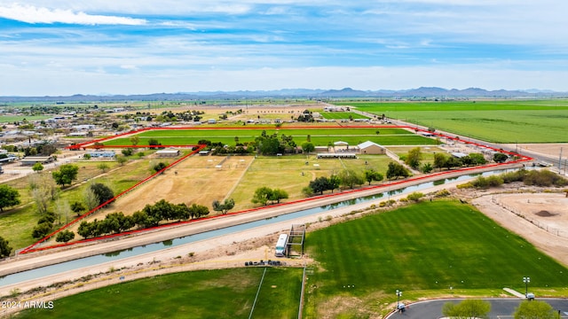 birds eye view of property with a mountain view and a rural view