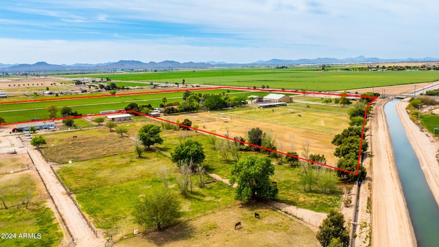 drone / aerial view featuring a mountain view and a rural view