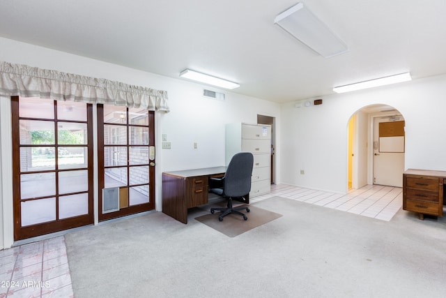 office space featuring light tile floors